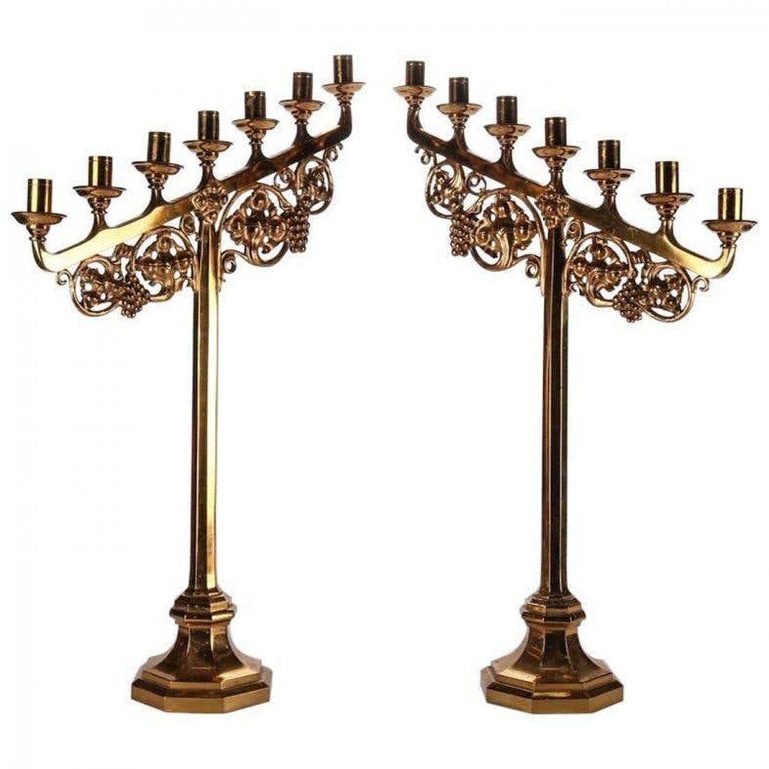 Pair of Gilt Gothic Style Seven-Light Candelabras: Pair oversize gilt Gothic style candelabra feature seven candles with grape and scroll motif, 20th Century. Measure - 29.5"h x 20"w x 7"d. ***IN-HOUSE SHIPPING and DELIVERY QUICK QUOTES AVAILABLE UPON
