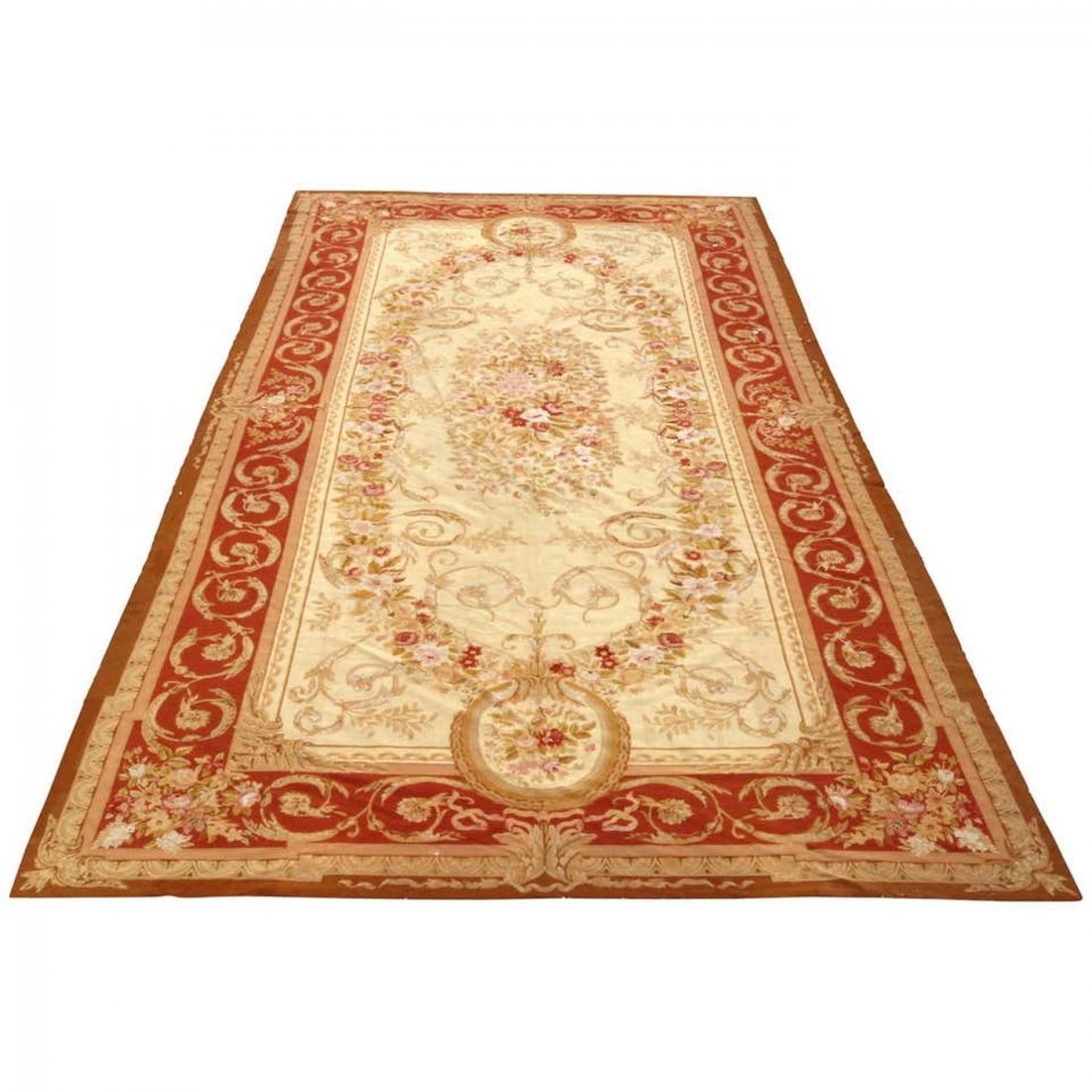 Room Size French Aubusson Tapestry Rug, 20th Century: A room size French Aubusson Tapestry rug offers oversized foliate central medallion on cream ground with detached floral spray and a scroll and foliate border in red, 20th century. Measures: 245" H x 