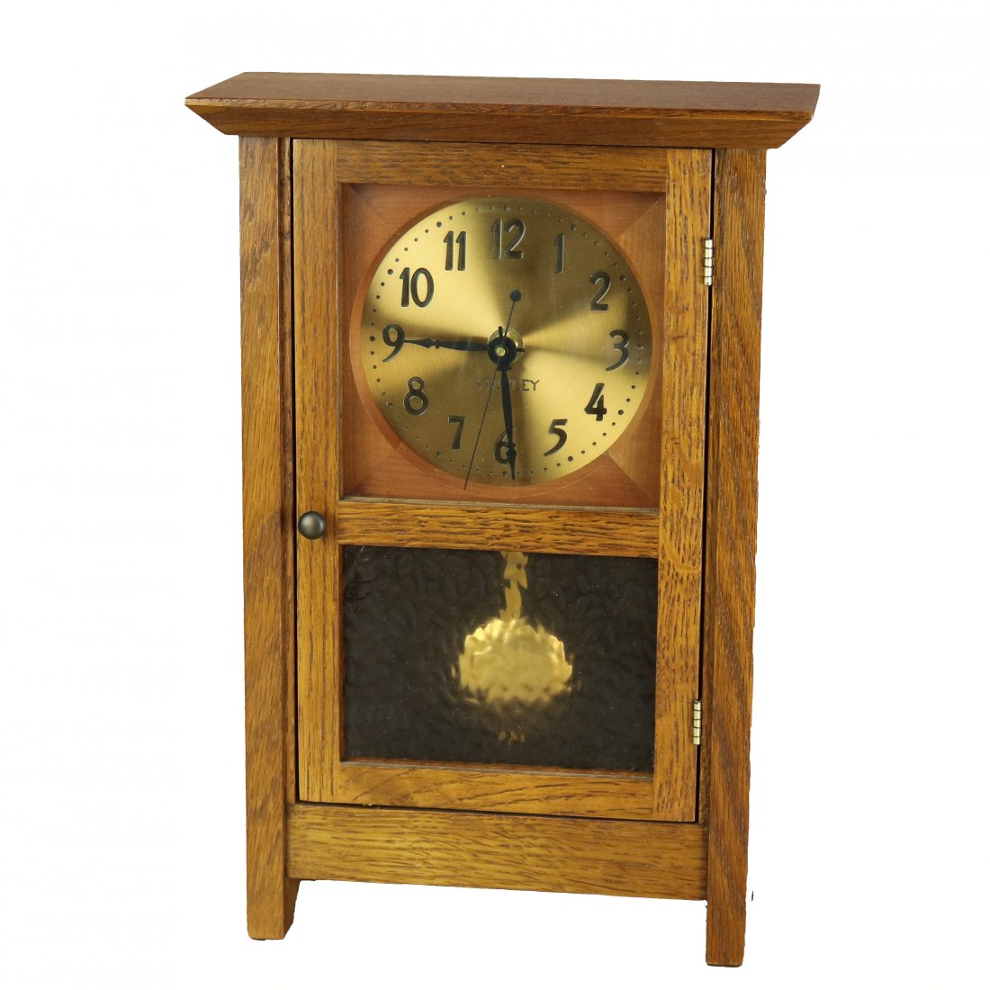 Arts & Crafts Mission Oak Stickley Mantle Clock, 20th C: An antique Arts and Crafts Mission mantle or desk clock by Stickley offers oak case with original label and brand stamp as photographed, back panel removes to battery operated works and pendulum, 20th