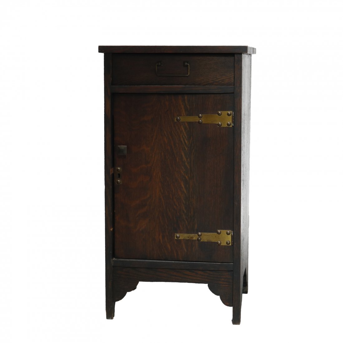 Arts & Crafts Stickley School Mission Oak Cellarette: An antique Arts and Crafts Mission cellarette in the manner of Stickley offers quarter sawn oak construction with upper drawer over lower single door cabinet having strap hinges and raised on straight