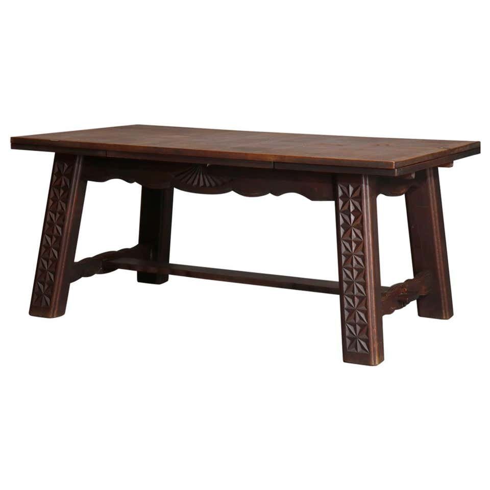 French Arts & Crafts Walnut Draw Top Dining Table: Antique French Arts and Crafts Renaissance carved walnut extension dining table with top having carved beveled bordering and pyramidal skirt with rosettes raised on turned legs with X-stretcher and bu