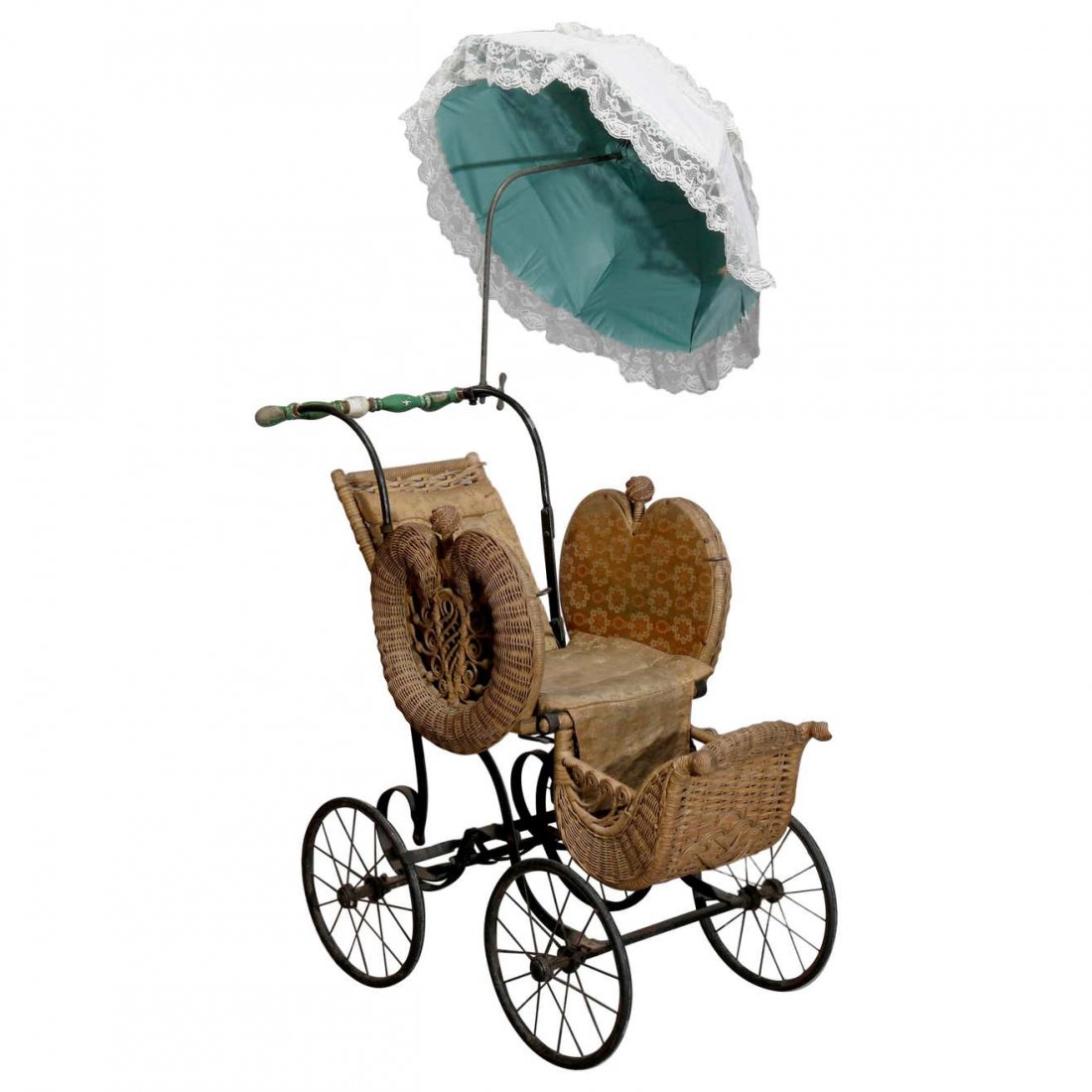 Heywood Wakefield Style Wicker Buggy with Parasol: An antique Victorian baby buggy in the manner of Heywood Wakefield offers wicker construction with stylized heart form sides and parasol, c1890. Measures: 53" H x 47" W x 22" D. *** NOTE - Onsite retr