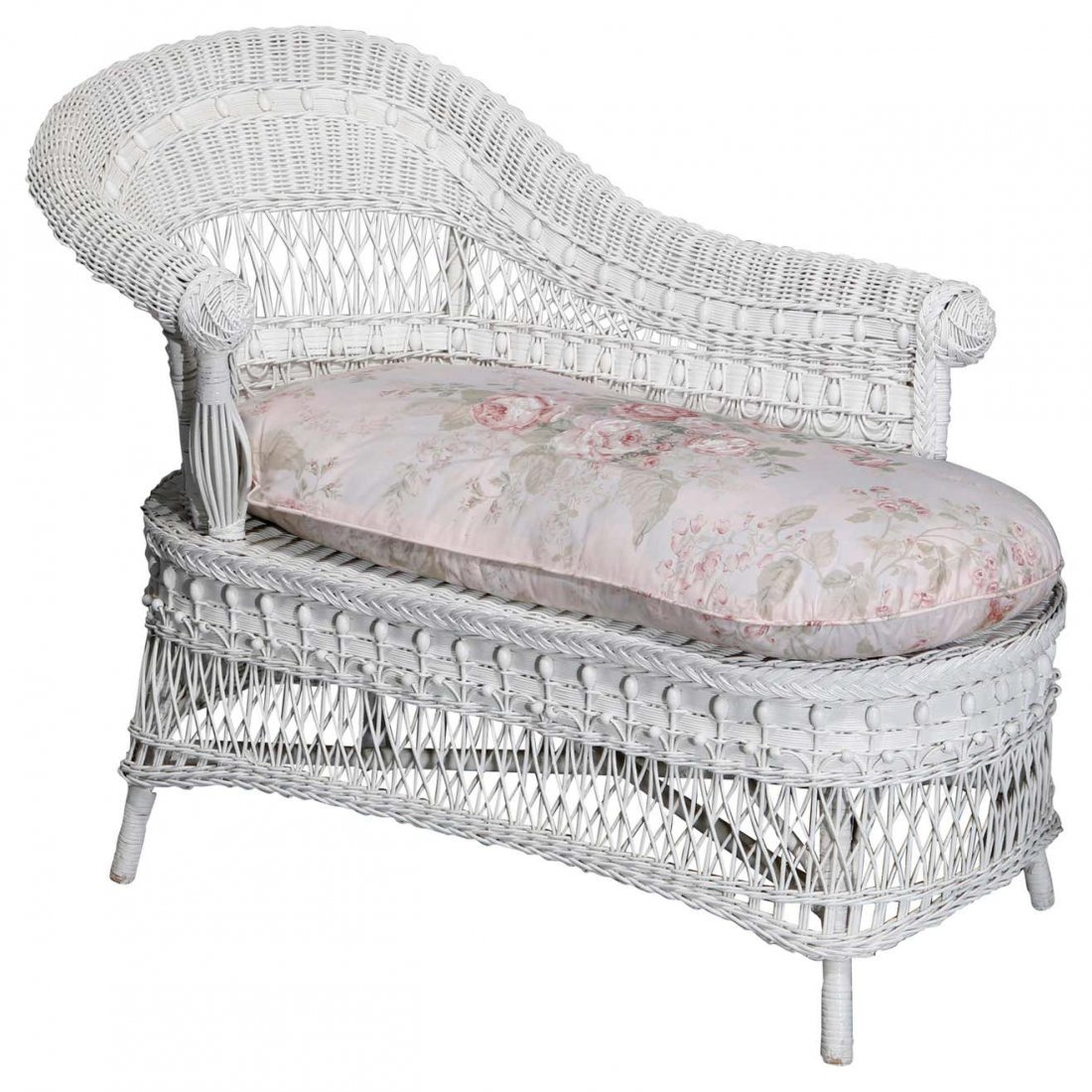 Antique Heywood Wakefield School Wicker Recamier, 20thC: An antique recamier in the manner of Heywood Wakefield offers white wicker construction with scroll form back and arm, floral cushion included, 20th century. Measures: 36" H x 49.25" W x 22.5" D. *** 