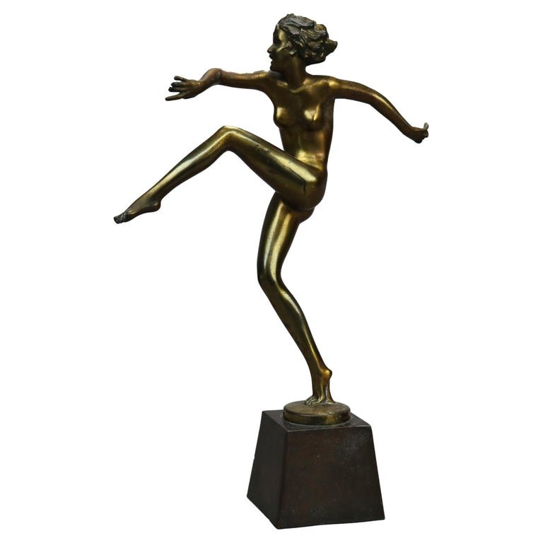 Antique Art Deco Ronson Metal Dancing Nude Figure, Gold Finish, c1920: An antique Art Deco Ronson figure offers cast metal dancing nude woman on plinth, c1920Measures - 13.75''H X 3.25''W X 9.25''D. *** OPTIONAL SHIPPING & DELIVERY - While onsite retrieval is always welc