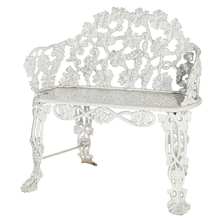 Antique Cast Iron Grape & Leaf Garden Bench, Painted White, c1940: An antique garden bench offers cast iron construction in grape and leaf pattern, painted white, c1940.Measures- 32.5''H x 32.5''W x 19.5''D. *** OPTIONAL SHIPPING & DELIVERY - While onsite retrieval i