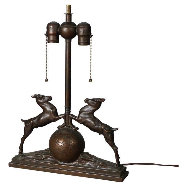 Antique Art Deco Bronzed Metal Figural Table Lamp circa 1920: An antique Art Deco table lamp offers bronzed cast metal construction with flanking figures and double sockets, c1920. Measures - 18"h x 13.25"w x 2.75"d. *** OPTIONAL SHIPPING & DELIVERY - While onsi