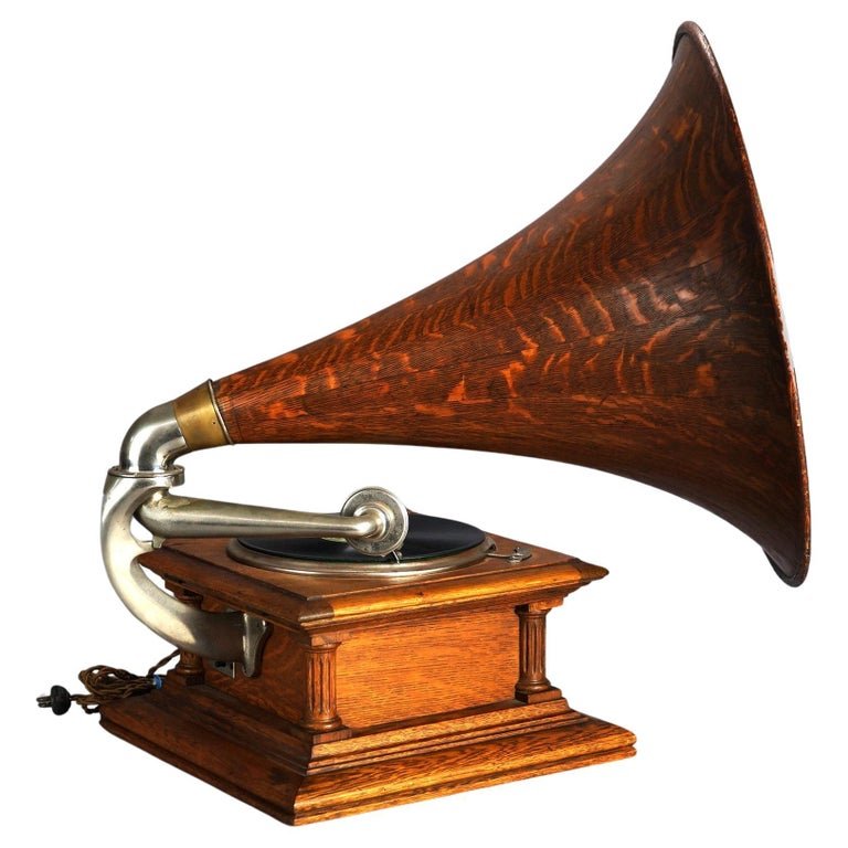 Antique Columbia Oak Table Top Victrola with Tiger Stripe Oak Horn Circa 1900: Antique Columbia Graphophone Oak Table Top Victrola with Grecian Doric Column Corners and Tiger Stripe Oak Horn; Record is: Columbia. Val Halsad Skona Morounstud; c1900. Measures- 31''H x 24''W x 27.7