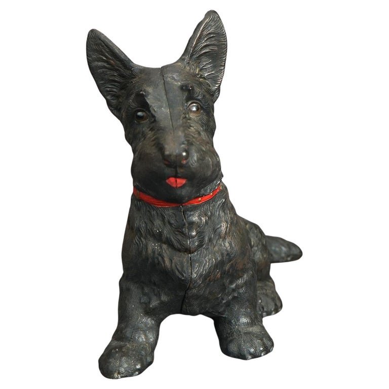 Oversized Antique Hubley School Cast Iron Scottish Terrier Dog Door Stop C1900: Oversized antique figural door stop in the manner of Hubley offers painted cast iron construction in the form of a seated Scottish Terrier (Scottie dog); unsigned; c1900. Measures- 11.5''H x 6.25''W x