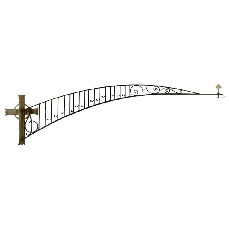 Antique Arts & Crafts 12’ Wrought Iron Church Boom & Hammered Cross Plate C1920: An antique Arts and Crafts church boom offers hammer cross mounting plate with wrought iron swing arm in scroll and musical form terminating in a cross, c1920. Measures- Boom 34'' High x 144'' long x