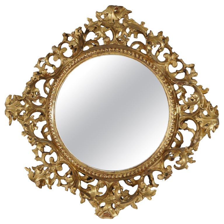 Antique Italian Reticulated Rococo Giltwood Wall Mirror 19thC: An antique Italian Rococo wall mirror offers foliate form reticulated giltwood frame, 19th century. Measures - 17.75"diam x 3"h. *** OPTIONAL SHIPPING & DELIVERY - While onsite retrieval is always wel