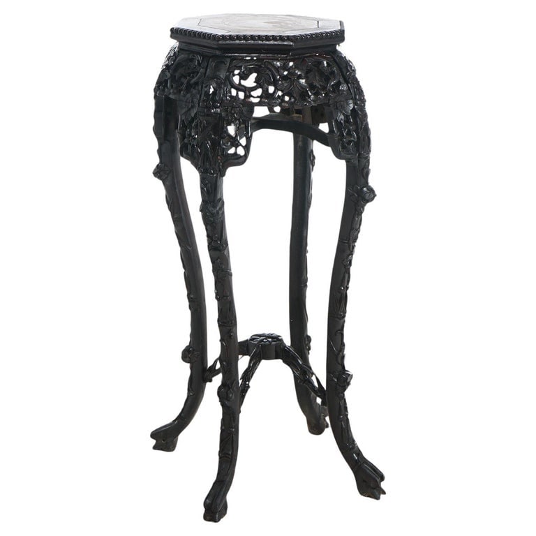 Antique Chinese Carved Rosewood & Inset Rouge Marble Plant Stand C1900: Antique Chinese plant stand with rouge marble top inset within rosewood base having carved foliate, bead and floral elements with stylized paw feet, c1900. Measures - 35.5"H x 16"W x 16"D. *** OPTIONA
