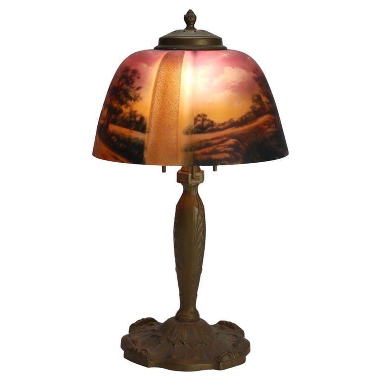 Antique Pittsburg Linen Fold Reverse Painted Landscape Table Lamp C1920: Antique Pittsburg Linen Fold Reverse Painted Landscape Table Lamp C1920. Measures - 13"H x 10"W x 10"D. This exquisite antique table lamp, dating back to circa 1920, features a reverse painted landsca