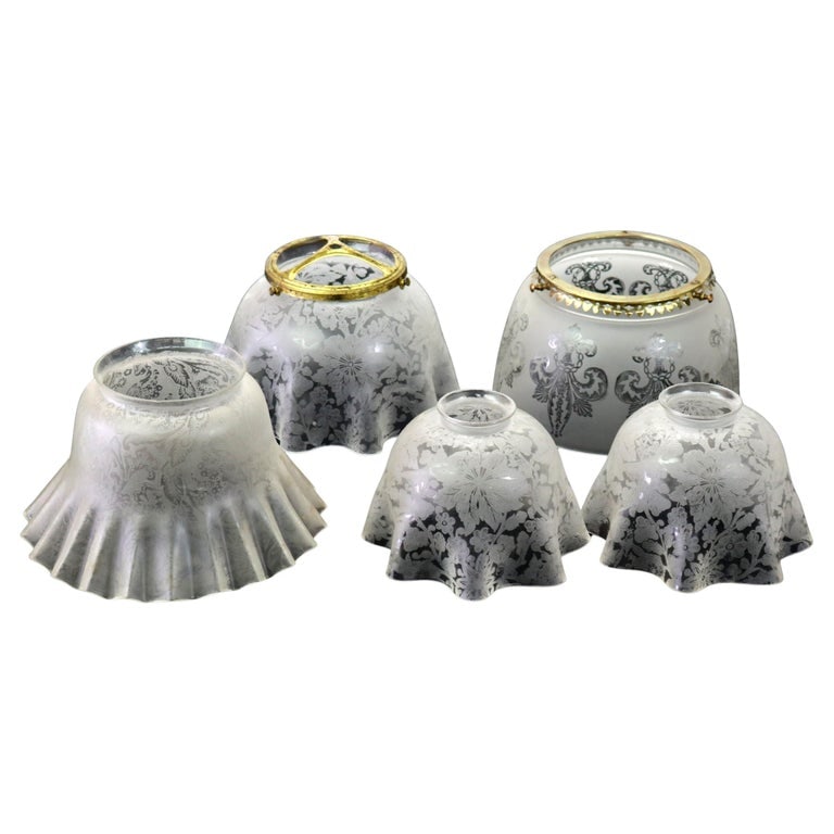 Five Antique Etched Glass Gas Light Shades C1890: Five Antique Etched Glass Gas Light Shades C1890. Dimensions - 2 small 4 1/8" x 6 1/4"; 1 med no brass 4 5/8" x 8" x 8"; 1 with brass 5 1/8" x 7 1/2" x 7 1/2"; Fleur de lis 4 1/2" x 7 1/4" x 7 1/4". F