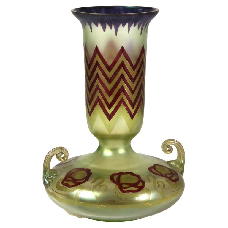 10" Loetz Egyptian Revival Polychromed Art Glass Vase Unsigned C1930: Antique Loetz Egyptian Revival Polychromed Art Glass Vase Unsigned C1930. Measures - 9 3/4" x 6 5/8" x 6 1/4". This antique vase is attributed to Loetz, renowned for their innovative art glass designs