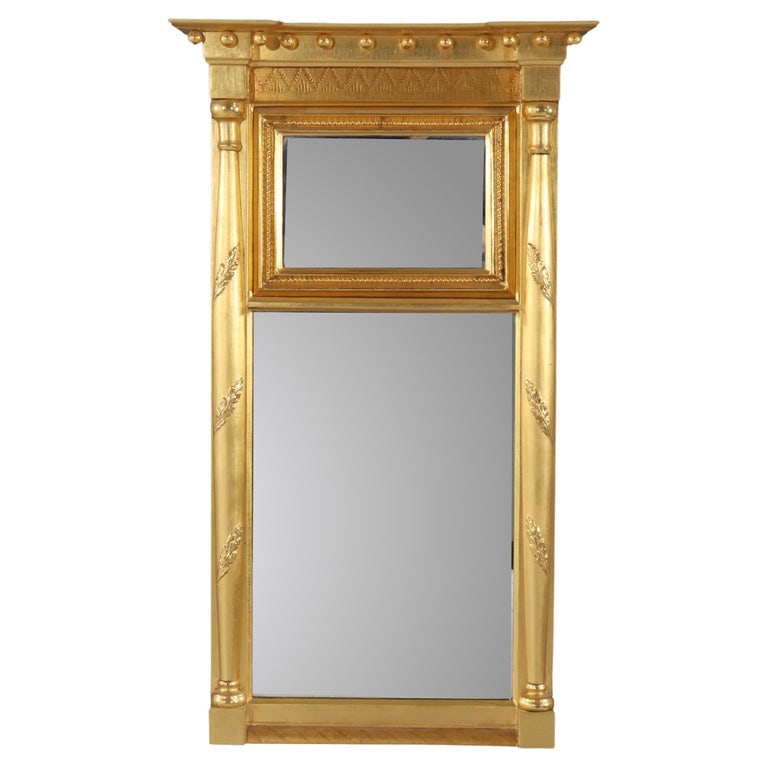 Vintage Federal Trumeau Gilt Wall Mirror 20thC: Vintage Federal Trumeau Gilt Mirror 20thC. Measures - 39.75"H x 23.25"W x 4"D. A vintage Federal-style trumeau mirror from the 20th century, featuring a gilt wood frame with classical detailing. The m