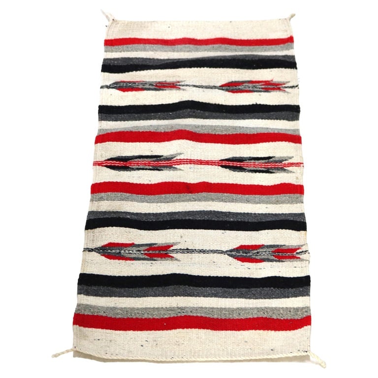 42" Southwest Native American Woven Wool Throw Rug with Stylized Arrow Stripes C1930: Antique Southwest Native American Woven Wool Throw Rug with Stylized Arrow Feather Stripes C1930. Measures- 42"L x 19.75"W x .5"D. *** OPTIONAL SHIPPING & DELIVERY - While onsite retrieval is always w