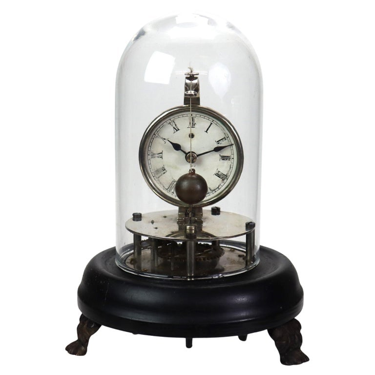 Early Dome Encased Skeleton Clock C1830: Antique Early Dome Encased Skeleton Clock Unsigned C1830. Measures - 8"H x 5.5"W x 5.5"D. This antique skeleton clock, dating back to circa 1830, features a classic dome encasement. It showcases a del
