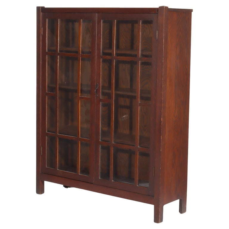 Arts & Crafts Stickley School Double Door Oak Bookcase C1920: Arts & Crafts Stickley School Double Door Oak Bookcase C1920. A classic example of Arts & Crafts design, this Stickley School double door bookcase is crafted from oak, dating back to circa 1920. The p