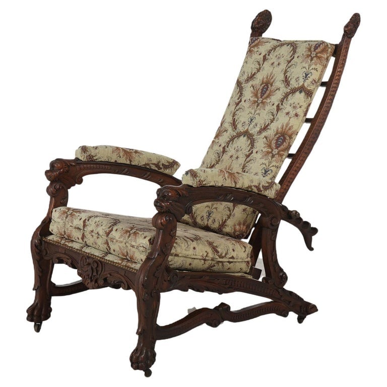 Victorian Renaissance Revival Figural Carved Walnut Morris Chair C1890: Antique Victorian Renaissance Revival Figural Carved Walnut Morris Chair with Carved Heads, Foliate Elements and Paw Feet, Upholstered Back & Seat, C1890. A stunning example of Victorian Renaissance R