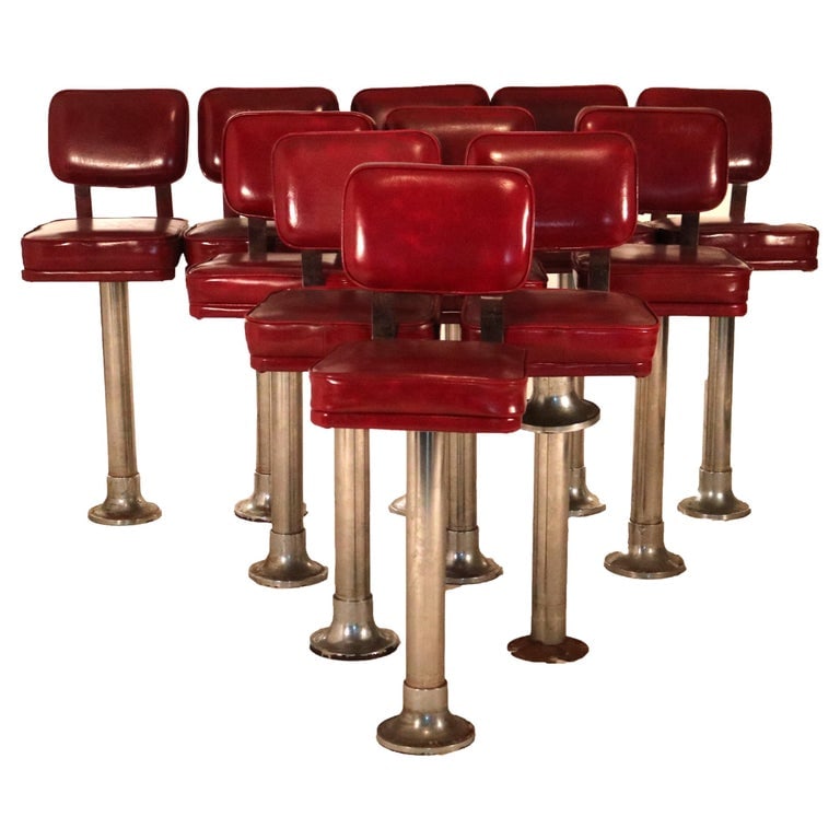 Eleven Mid Century Modern Chrome & Vinyl Diner or Ice Cream Counter Stools C1950: Eleven Mid Century Modern Chrome & Red Vinyl Swivel Diner or Ice Cream Counter Stools C1950. Measure - 46 1/2 h x 17 1/2 d 15 1/2 w SH: 32. *** OPTIONAL SHIPPING & DELIVERY - While onsite retrieval is