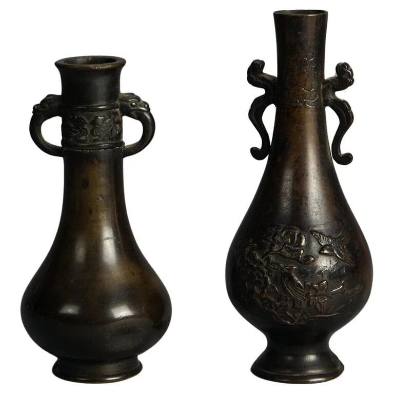 Pair of Antique Japanese Meiji Cast Bronze Vases C1920: A pair of exquisite antique Japanese bronze vases from the Meiji period, circa 1920. These vases feature intricate designs typical of the era, with one vase adorned with dragon handles and the other w