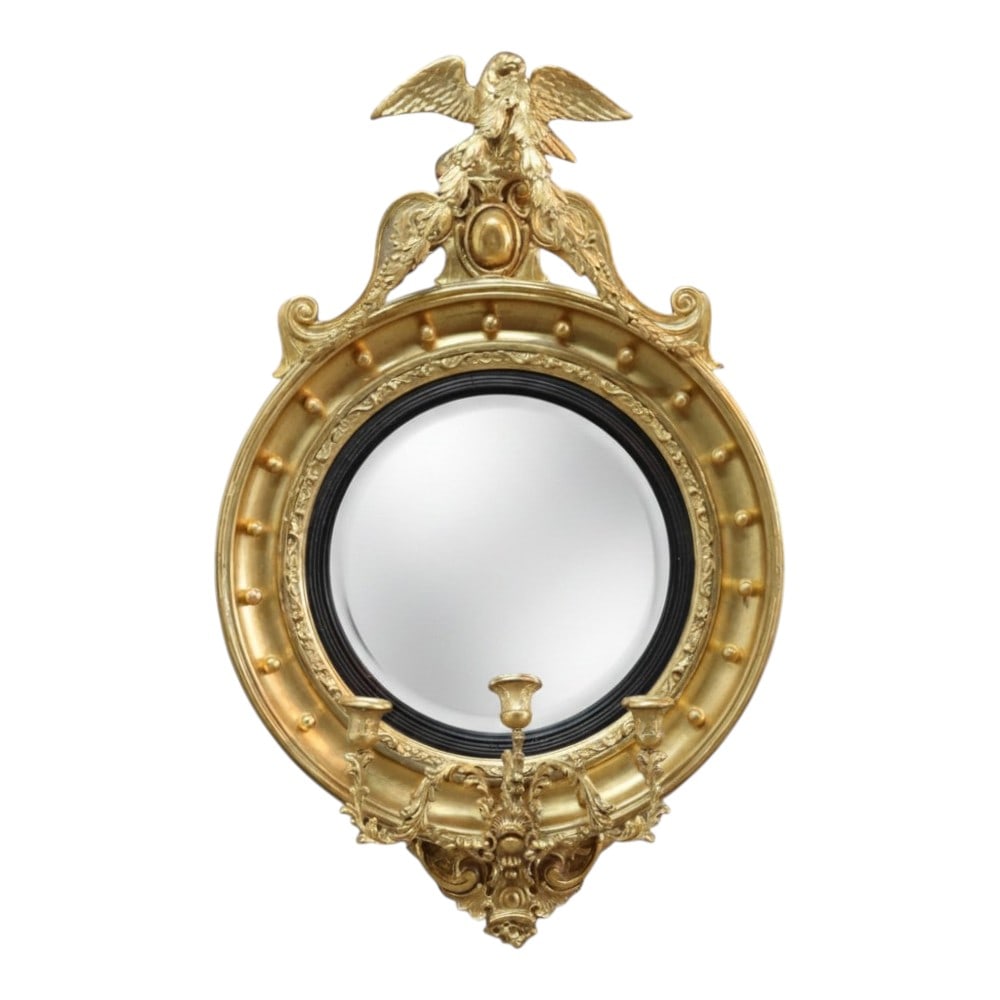 Federal Centennial Figural Eagle 45" Gilt Wood Convex Wall Mirror C1870: This antique Federal Centennial convex wall mirror, dating to approximately 1870, features a prominent figural eagle crest. The mirror is crafted from gilt wood, showcasing a rich gold finish. The des