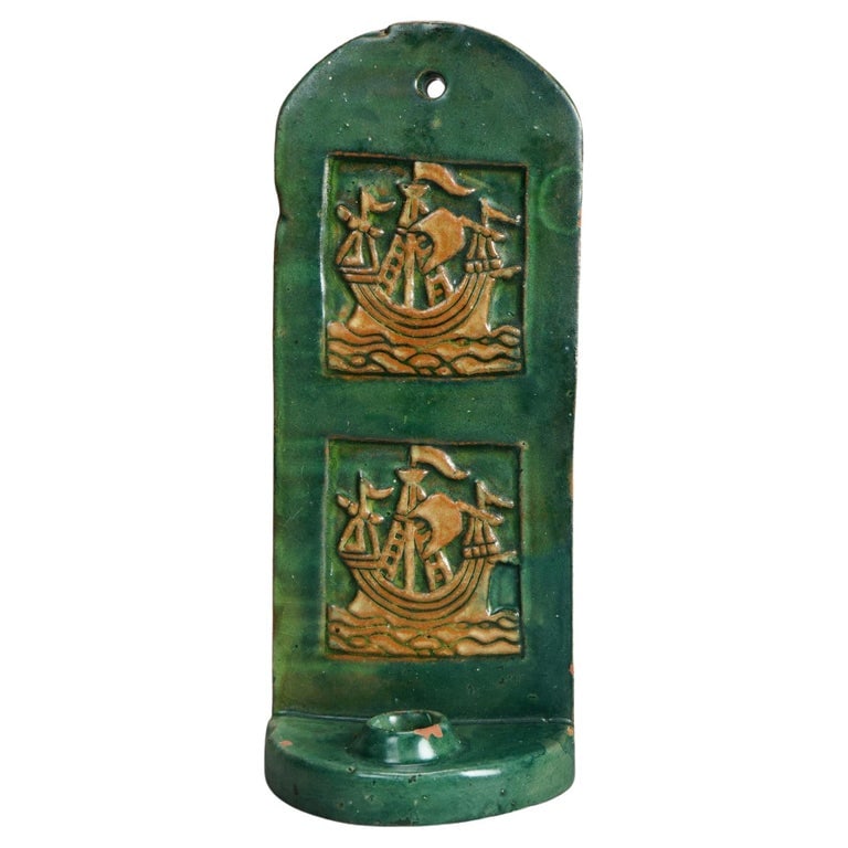 Arts & Crafts Monmouth Pottery Slab Terra Cotta Candle Sconce, Bucks County, c1910: An antique candle sconce crafted by Monmouth Pottery around 1910, originating from Bucks County. This piece features a slab terra cotta design with a rich green glaze and intricate ship motifs. The sc