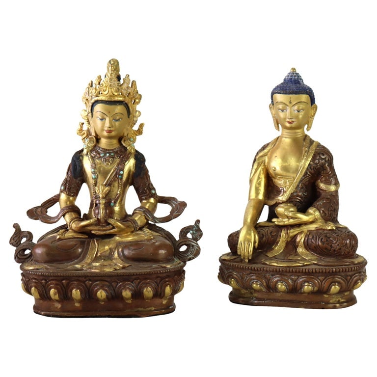 Two Bronze Buddhas: Medicine Buddha & Aparmita Buddha Of Infinite Life C1920: Pair Of Antique 2-Toned Bronze Buddhas: Medicine Buddha & Aparmita Buddha Of Infinite Life C1920. Measures - 8 1/4" x 6 1/4" x 3 1/4"; 7 7/8" x 5 1/4" x 3 3/4". *** OPTIONAL IN-HOUSE SHIPPING & DELIVE