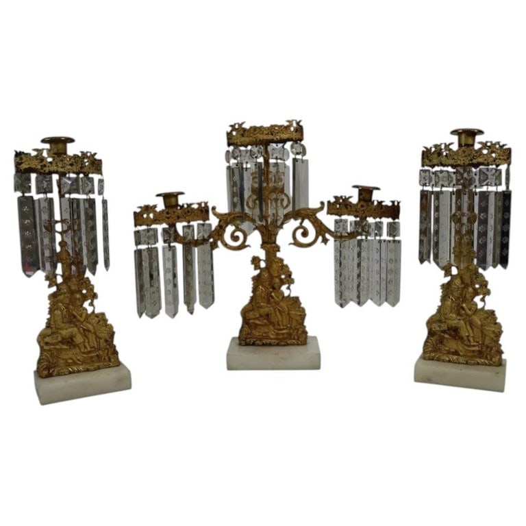 3 Piece Gilt Bronze & Crystal Figural Girandole Set: 3 Piece Gilt Bronze & Crystal Figural Girandole Set. Measures - 15.75"H x 17"W x 4"D. *** OPTIONAL IN-HOUSE SHIPPING & DELIVERY - While onsite retrieval is always welcome at no charge, IN-HOUSE SHIPPI