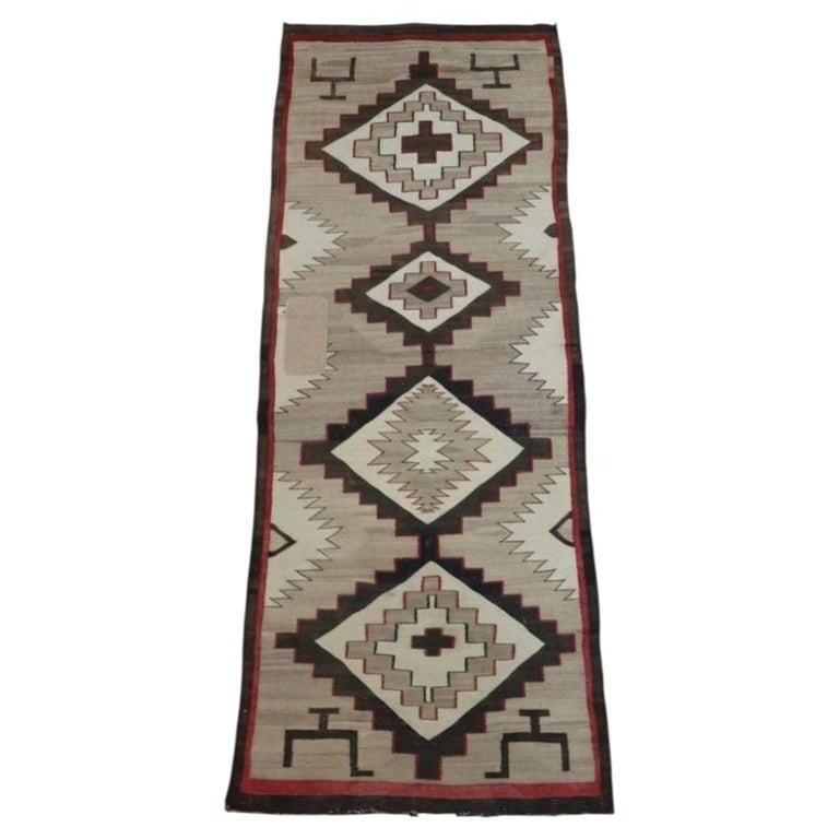 Native American Indian Navajo 104"x44" Woven Wool “Eye Dazzler” Runner Rug C1920: Native American Indian Navajo Woven Wool “Eye Dazzler” Runner Rug C1920. Measures - 104.5"L x 43.5"W. *** OPTIONAL IN-HOUSE SHIPPING & DELIVERY - While onsite retrieval is always welcome at no