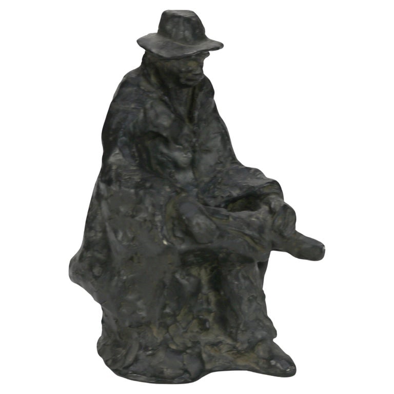 Petronzio 9" Bronze Sculpture “The Sittin’ Man” C1930: A captivating bronze sculpture titled 'The Sittin’ Man' by artist Petronzio, dating back to circa 1930. This piece features a seated figure, exuding a sense of contemplation and tranquility. The art