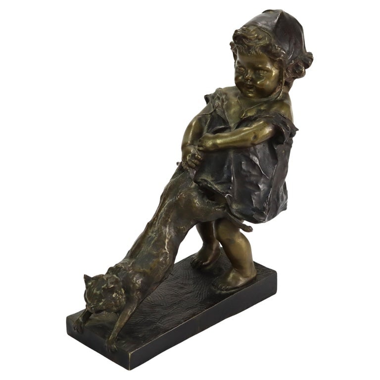 Juan Clara 1st Edition 10" Bronze Figure “Toddler With Cat” C1900: A bronze sculpture by Juan Clara, depicting a toddler with a cat. This piece is a first edition, signed by the artist, and dates to circa 1900. The sculpture showcases fine detailing in the toddler's 
