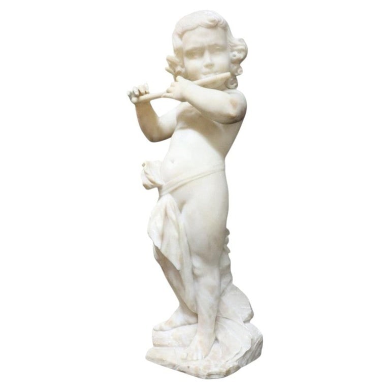 Carved Marble 23" Cherub Flute Player Sculpture 19thC: Carved Marble Cherub Flute Player Sculpture 19thC. Measures - 23"H x 8.75"W x 6.5"D. *** OPTIONAL IN-HOUSE SHIPPING & DELIVERY - While onsite retrieval is always welcome at no charge, IN-HOUSE SHIPPIN