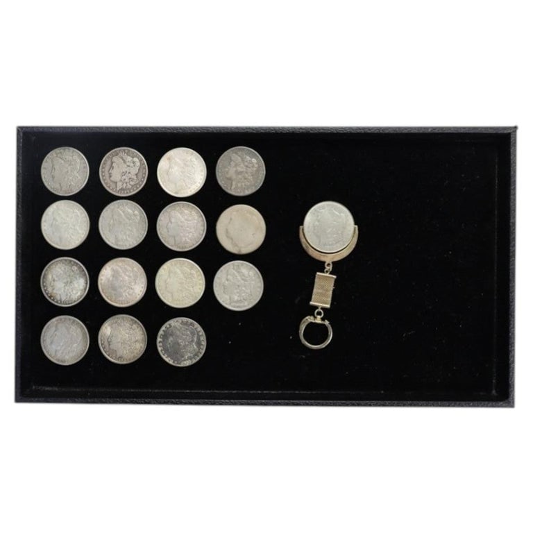 16 Morgan Silver Dollars C1879-1921: 16 Morgan Silver Dollars C1879-1921. Measures - 1.5"W x 1.5"D. *** OPTIONAL IN-HOUSE SHIPPING & DELIVERY - While onsite retrieval is always welcome at no charge, IN-HOUSE SHIPPING & DELIVERY for this 