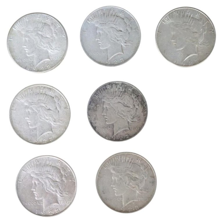 7 Silver Peace Dollars C1922-1923: 7 Silver Peace Dollars C1922-1923. Measures - 1.5"W x 1.5"D. *** OPTIONAL IN-HOUSE SHIPPING & DELIVERY - While onsite retrieval is always welcome at no charge, IN-HOUSE SHIPPING & DELIVERY for this it