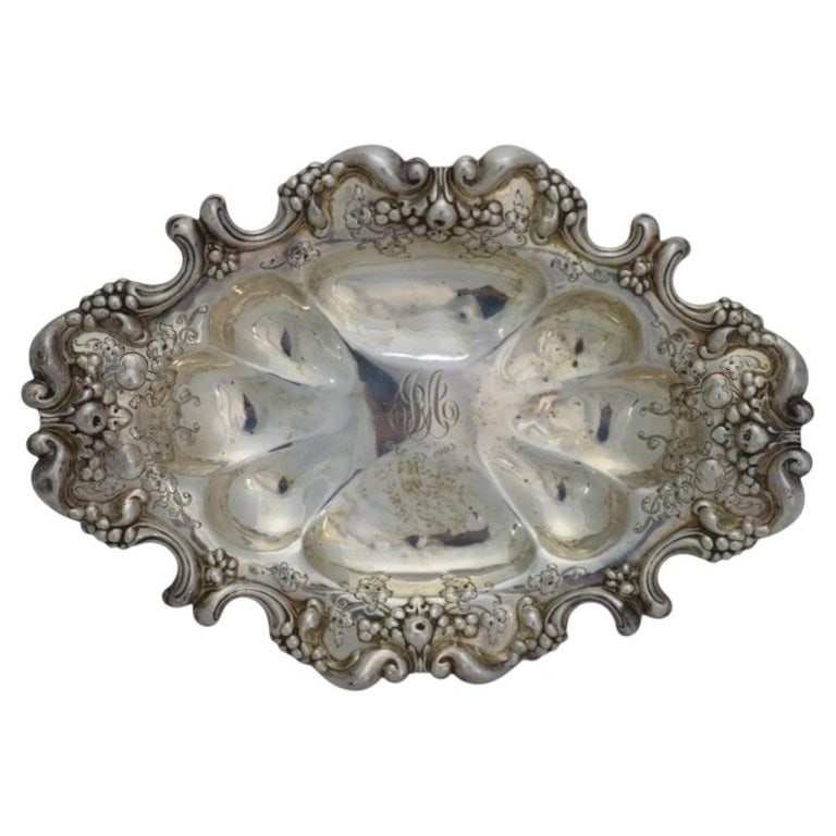 Sterling Silver Rococo Revival Style Oval Serving Dish, 18.7 Troy Ounce: Sterling Silver Rococo Revival Style Oval Serving Dish, 18.7 Troy Ounce. Measures - 2.5"H x 13.5"W x 10"D. *** OPTIONAL IN-HOUSE SHIPPING & DELIVERY - While onsite retrieval is always welcome at no ch
