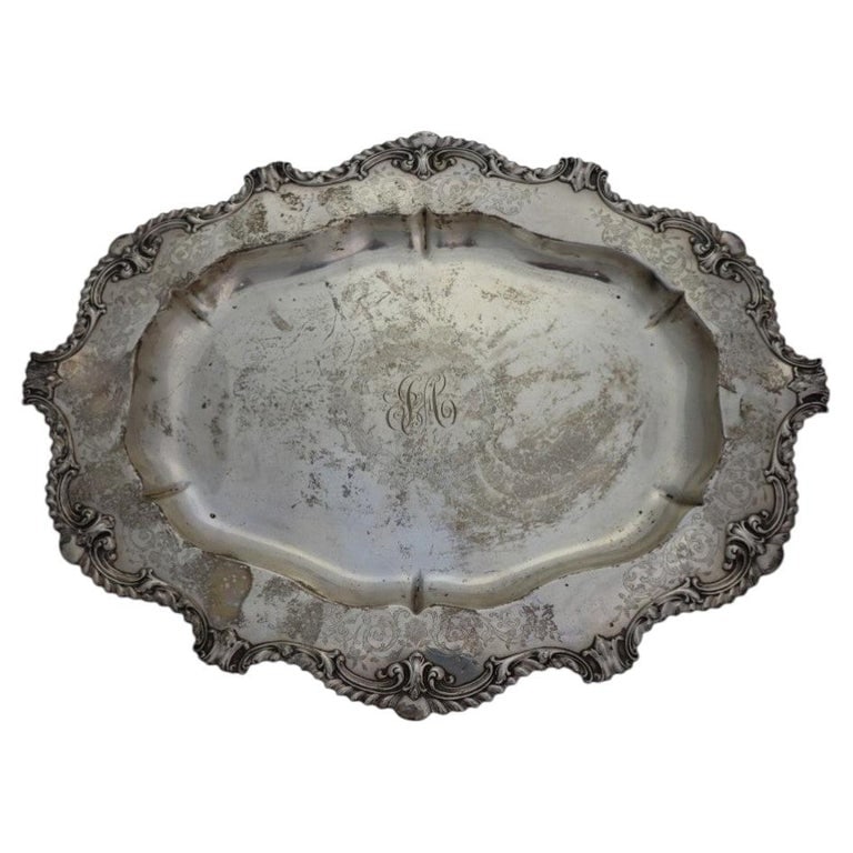 Sterling Silver Serving Tray With Repousse Edges 31.3 Troy Ounces: Sterling Silver Serving Tray With Repousse Edges Sterling Mark 31.3 Troy Ounces. Measures - 1.25"H x 16.75"W x 13"D. *** OPTIONAL IN-HOUSE SHIPPING & DELIVERY - While onsite retrieval is always welcom