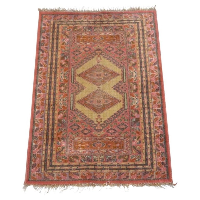 Antique Kurdish Oriental 54"x36" Wool Area Rug C1920: This antique Kurdish Oriental area rug, dating to circa 1920, exemplifies traditional textile artistry. Crafted from wool, it is likely hand-knotted. The rug features a vibrant palette dominated by sh