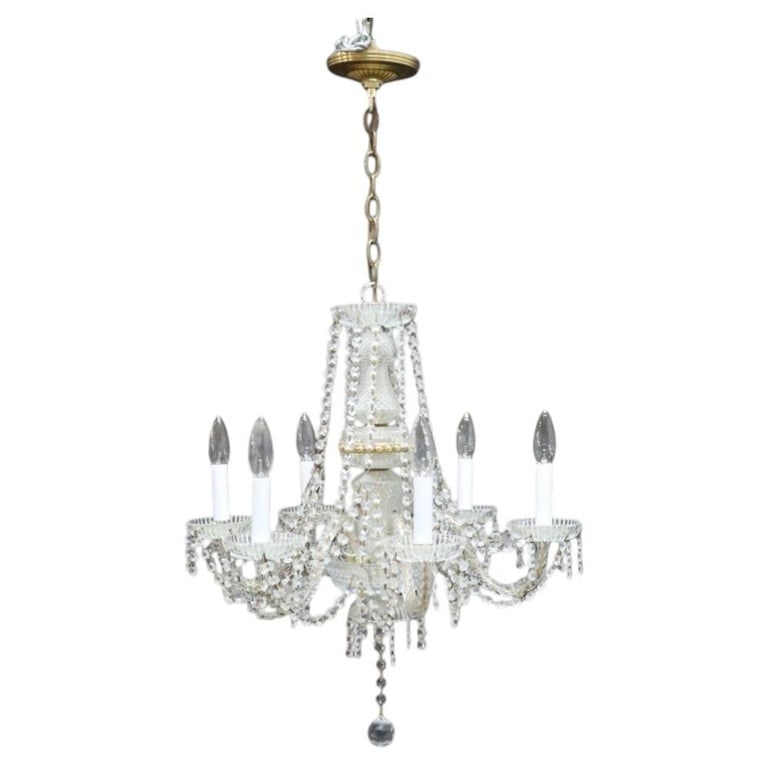 Vintage Crystall & Brass 6-Light Chandelier C1940: This vintage chandelier, dating to approximately 1940, features a six-light design crafted from a combination of crystal, glass, and brass elements. The central column is adorned with faceted glass an