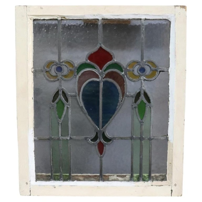 Frank Lloyd Wright Style Arts & Crafts Leaded Stained Glass Windo C1920: This antique leaded stained glass window, dating to approximately 1920, exemplifies the aesthetic principles of the Arts & Crafts movement, specifically drawing inspiration from Frank Lloyd Wright. Th