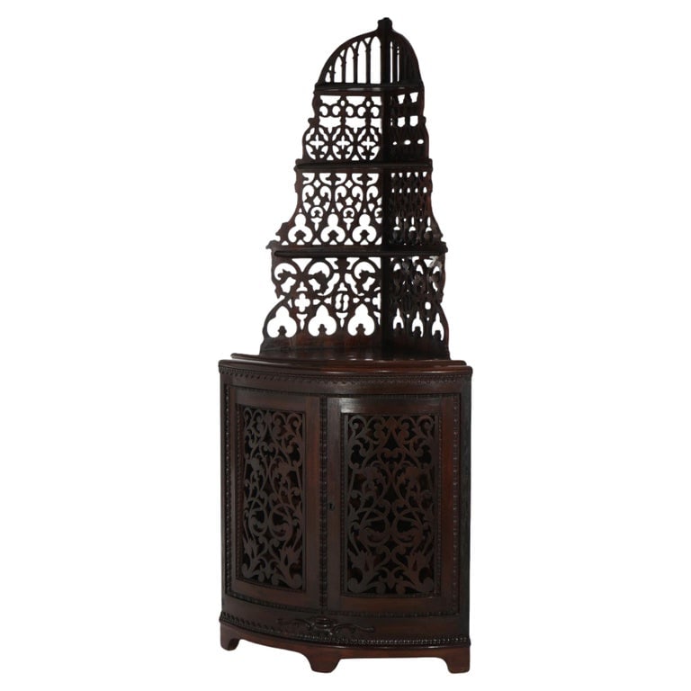 Victorian Rosewood Etagere with Reticulated & Graduated Carved Shelving: A striking example of Victorian craftsmanship, this antique etagere is crafted from rich rosewood. It features intricately reticulated and graduated carved shelving, showcasing the ornate design typic