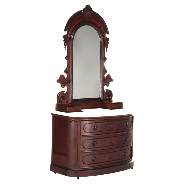 Berkey & Gay School Victorian Walnut & Marble Dresser With Ebonized Trim C1880: This Victorian-era dresser, crafted by Berkey & Gay, features a walnut construction with ebonized trim. The piece is topped with a marble surface and includes a mirror with intricate carvings typical 