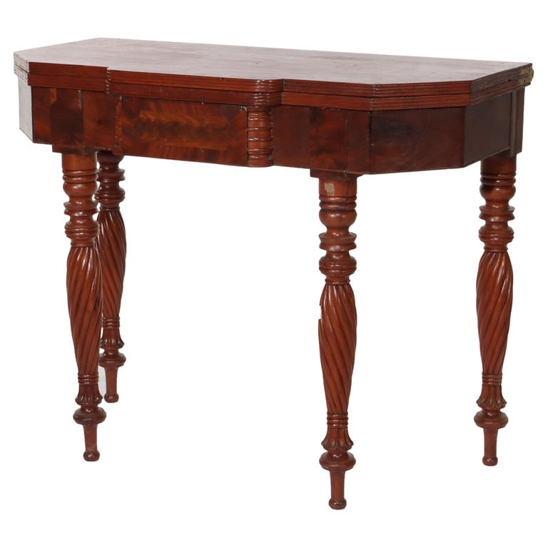 Sheraton Mahogany Card Table C1830: This antique card table, dating to circa 1830, is crafted in the Sheraton style, known for its refined and classical design elements. Made from rich mahogany, the table features turned and reeded legs