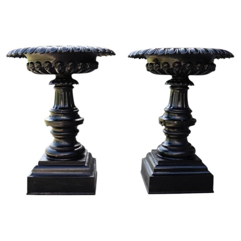 Pair Large Antique Co-operative Foundry Figural Cast Iron Garden Urns C1900: A distinguished pair of large antique cast iron garden urns, produced by the Co-operative Foundry Company, Rochester, N.Y., circa 1900. These substantial urns feature classical fluted bowls adorned wi