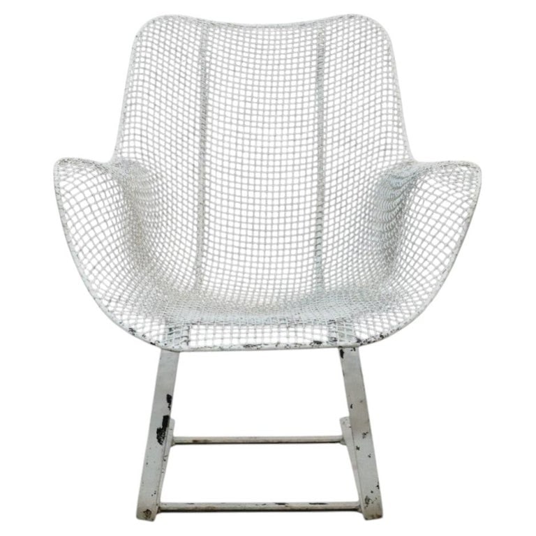 Vintage Russell Woodard (attr) Wire Patio Spring Chair C1960: This is a vintage Russell Woodard (attr) wire mesh spring lounge chair, dating to approximately the 1960s. The chair features a distinctive contoured seat and back crafted from woven wire mesh, charac