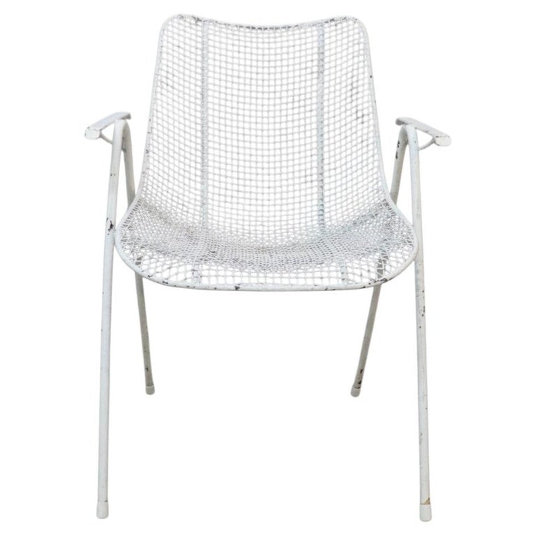 Vintage Russell Woodard (attr) Wire Patio Armchair C1960: This vintage Russell Woodard (attr) armchair exemplifies Mid-Century Modern design, crafted from white-painted wire mesh. The chair features a distinctive openwork pattern for both the seat and backre