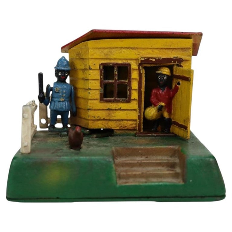Reproduction Book Of Knowledge Uncle Remus Mechanical Bank 20thC: Reproduction Book Of Knowledge Uncle Remus Mechanical Bank 20thC. Measures - 4.5"H x 5.5"W x 3.5"D. *** OPTIONAL IN-HOUSE SHIPPING & DELIVERY - While onsite retrieval is always welcome at no charge, I