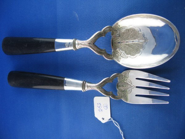 ARABIAN SILVER VEGETABLE SPOON: ARABIAN SILVER VEGETABLE SPOON WITH FAN FORM CHASING ON THE BOWL WITH EBONY HANDLE & MATCHING MEAT FORK, 10"L. CAMPBELL ESTATE