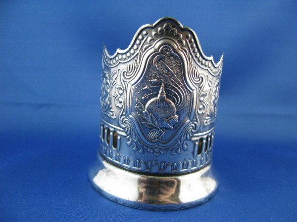 RUSSIAN CUP HOLDER: RUSSIAN CUP HOLDER DEPICTING SPUTNICK ROCKET AND THE KREMLIN, CIRCA LATTER 1950'S