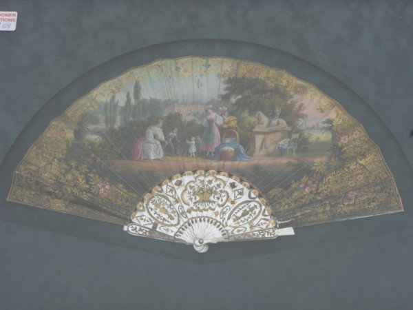 FAN IN FRAME: MOTHER OF PEARL AND GOLD GILT DEPICTING WOMEN AND CHILDREN AT PLAY 10" X 18"